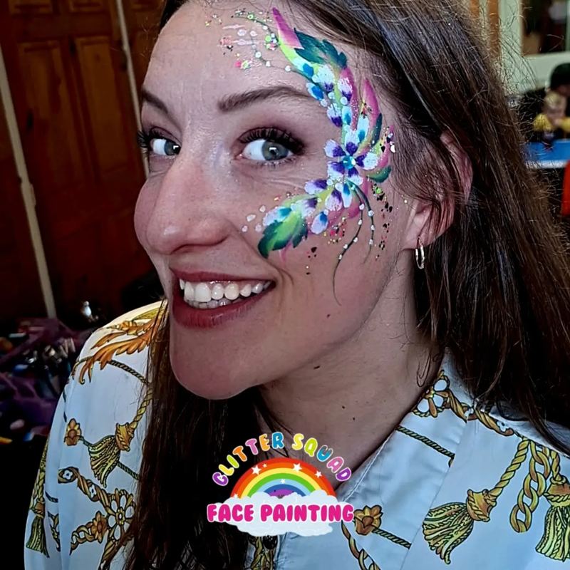 Colourful face design on an adult guest