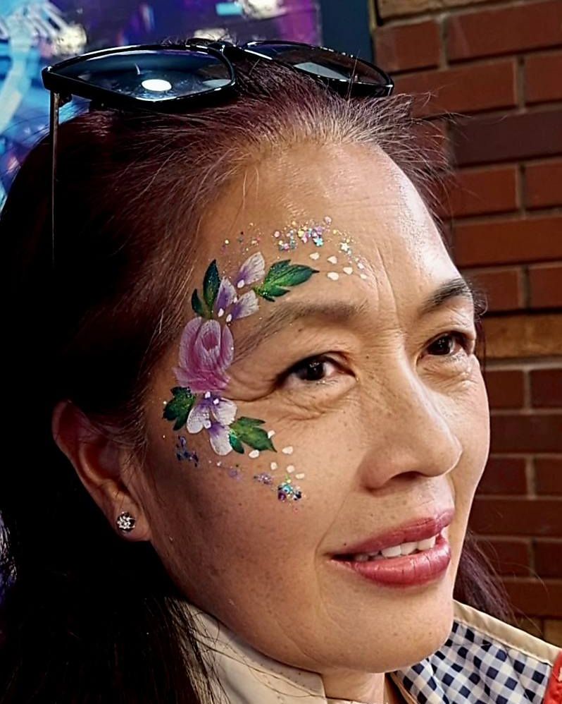 Pink rose face design with leaves and gems