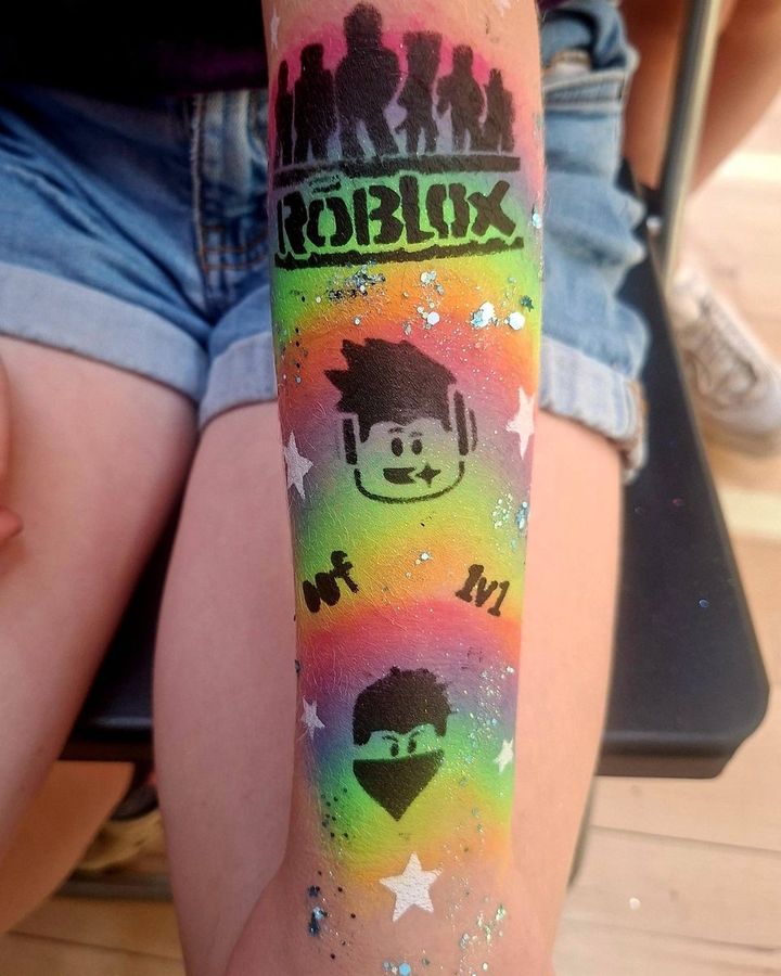Roblox arm painting on a rainbow background